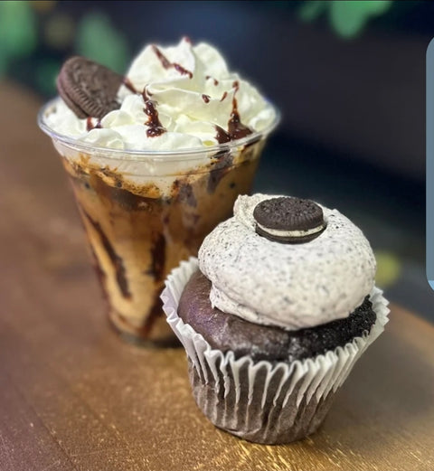 Cookies and cream cupcake and frappé on a wooden surface