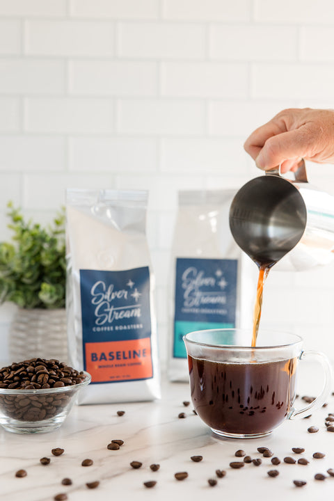 Fresh brewed Baseline house blend coffee being poured into a cup