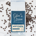 Silver Stream Coffee Roasters Wayfarer coffee package with coffee beans on a marble background